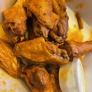 a plate of chicken wings