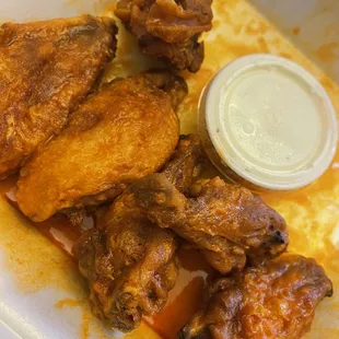 chicken wings in a styrofoam container