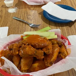 Gold fever wings in the front and spicy bbq in the back of the picture.