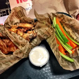Hawaiian and Lemon Pepper wings with a side of fresh crispy veggie sticks.