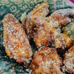 a basket of fried chicken wings