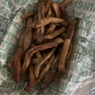 a basket of french fries on a table