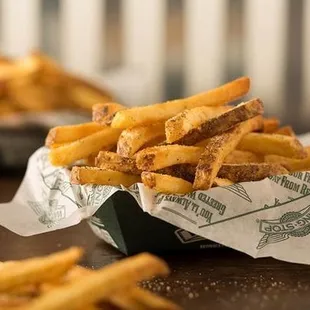 a basket of french fries on a table