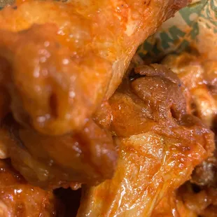 a closeup of a plate of chicken wings