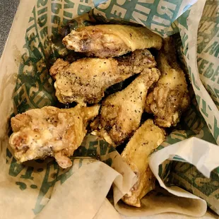 a basket full of chicken wings