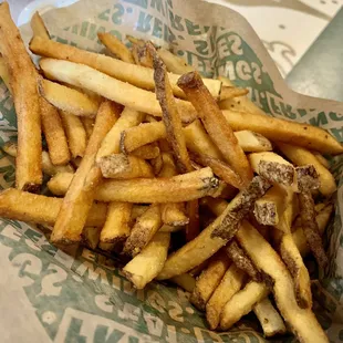 a basket of french fries on a table