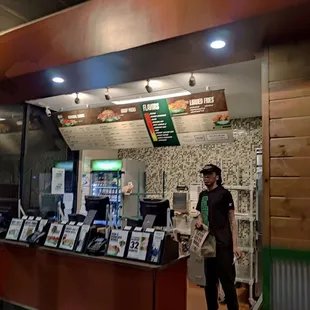 a man standing in front of a counter