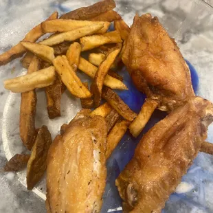 a plate of fried chicken and french fries