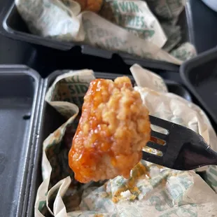 a piece of fried chicken on a fork
