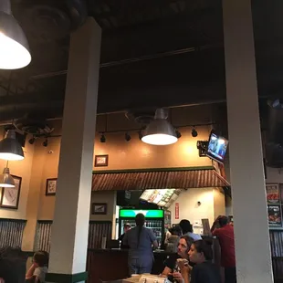 people sitting at tables in a restaurant