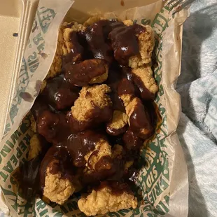 a tray of food with a fork in it