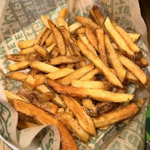 a basket of french fries on a table