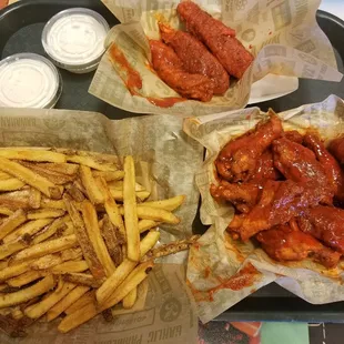 Cajun traditional wings, chicken tenders and fries