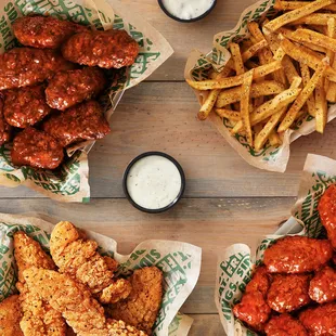 a variety of wings and fries