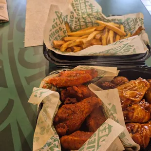Sweet Chili and Cajun wings with fries.