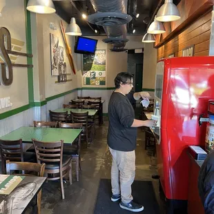 a man standing in a restaurant