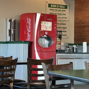 a coca cola machine in a restaurant