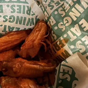 Hot chicken wing with feathers.