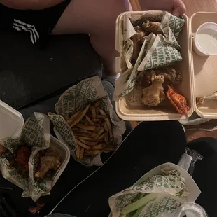 Wings, fries, and celery. One wing was eaten cause someone couldn't wait....