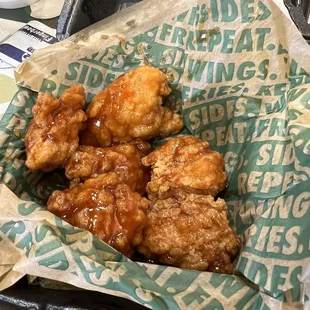 a basket of fried chicken and a cup of coffee