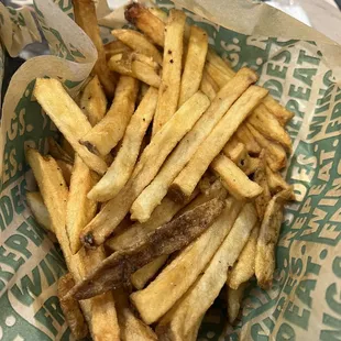 a basket of french fries on a table