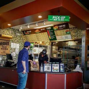a man standing in front of a counter