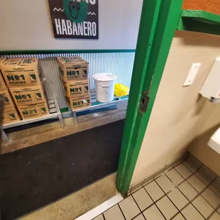 The container of starch flower is open. Im standing inside of the restroom.  To close.