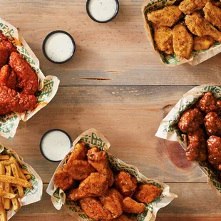 a variety of wings, fries, and dips