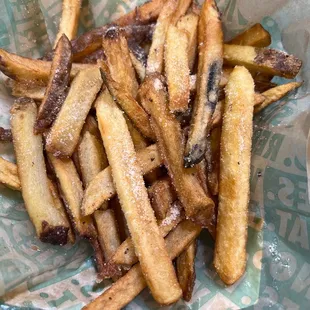 a basket of french fries on a table