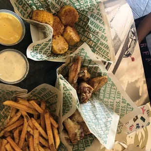 Lemon pepper wings, garlic Parmesan wings, fries, fried corn, ranch dressing and honey mustard dressing