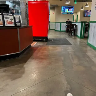 a person's feet in a restaurant