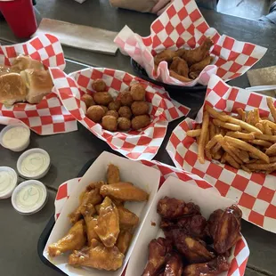 Wings, fries, mushrooms and rolls