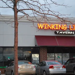 cars parked in front of a restaurant