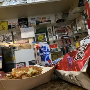 a sandwich and a soda on a counter