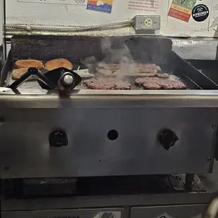 a grill with hot dogs on it