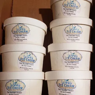 a stack of ice cream containers