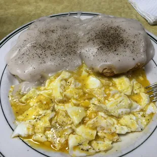 a plate of food with eggs and sausage
