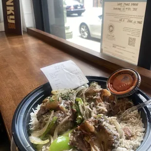 Oxtail (29.75) over steamed white rice with tabasco sauce.