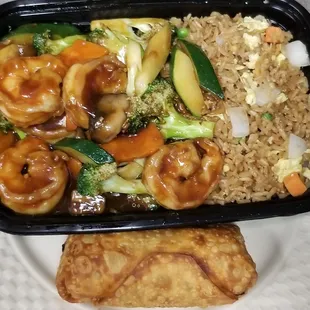 Shrimp with mixed vegetable special with fried rice and egg roll.