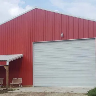 a red building with a white garage