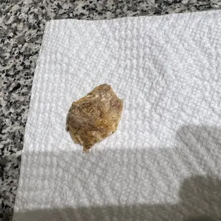 Cellophane wrapper the manager said fell in when the cook was moving too fast