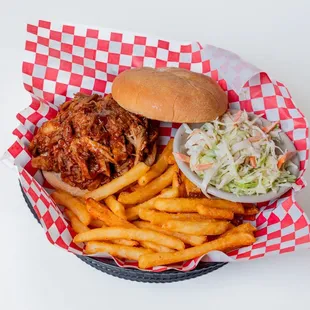 a pulled pork sandwich and fries