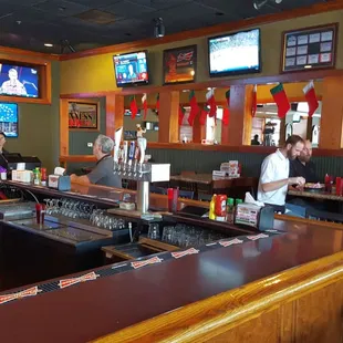 Main bar area surrounded by high-top tables and lots of TVs