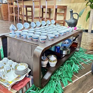 a table with plates and bowls on it