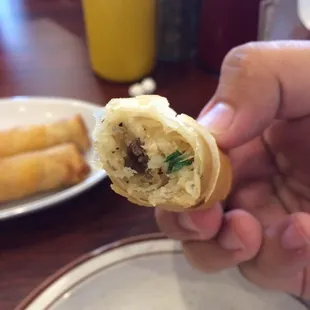 The inside of them egg roll- cabbage carrot ground meat. Crisp and cooked to perfection