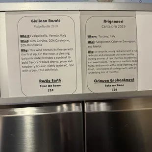 The explanation label of two wines along with the dispensing selector right underneath with the pricing.