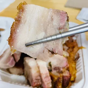 a fork picking up a piece of meat