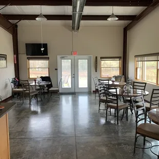 a large room with tables and chairs