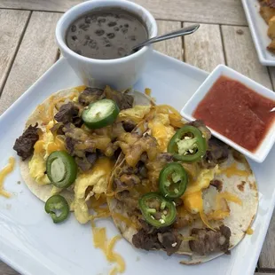 Breakfast Taco with ribeye, scrambled eggs, cheese, and perfect tortillas. Incredible! Also loved the side of Bacon Brunch Beans