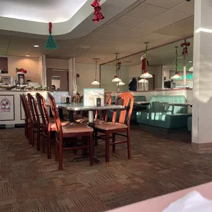 a restaurant with a table and chairs